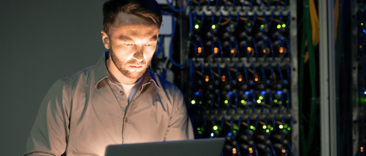 guy standing Infront of servers